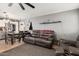 Open-concept living space with kitchen access, tile flooring, and a comfortable seating area at 10723 N 80Th Ln, Peoria, AZ 85345