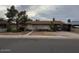 A single-story home with a front yard and covered parking; a street view of a modest Gathering house at 120 N Jackson St, Chandler, AZ 85225