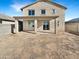 Back exterior of a two-story home featuring a covered patio at 13481 W Buckskin Trl, Peoria, AZ 85383