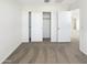 A bedroom featuring carpet floors and a closet with sliding doors at 13481 W Buckskin Trl, Peoria, AZ 85383