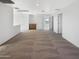 A large, carpeted loft area with an adjacent cabinet and doorway at 13481 W Buckskin Trl, Peoria, AZ 85383