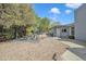 Serene backyard featuring desert landscaping, shaded seating area, and a private retreat at 140 W University Dr, Mesa, AZ 85201