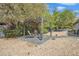 Stone patio and pergola featuring outdoor seating and desert landscaping at 140 W University Dr, Mesa, AZ 85201