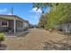 Tranquil backyard featuring desert landscaping, covered patio, and charming pergola seating area at 140 W University Dr, Mesa, AZ 85201