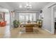 Open-concept dining room with tile floors and views to the kitchen and living areas at 140 W University Dr, Mesa, AZ 85201