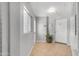 Bright entrance with tile flooring, a window and a decorative plant near the door at 140 W University Dr, Mesa, AZ 85201