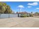 Charming single-story home with a long driveway, well-kept landscaping, and a gray exterior at 140 W University Dr, Mesa, AZ 85201