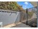 Wrought iron gate set in block wall featuring decorative concrete blocks at 140 W University Dr, Mesa, AZ 85201