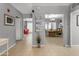 Inviting hallway featuring tiled floors with an open floorplan leading to the dining room and cozy living spaces at 140 W University Dr, Mesa, AZ 85201