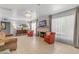 Spacious living room with neutral walls, tiled floors, a decorative fireplace, and large window with views at 140 W University Dr, Mesa, AZ 85201