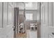 Accessible shower area with tiled walls, safety bars, shower curtain and seating at 140 W University Dr, Mesa, AZ 85201