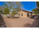 The backyard features a low maintenance yard, privacy fence, and the exterior of the house at 1541 W Lynne Ln, Phoenix, AZ 85041