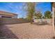 Expansive backyard featuring a privacy fence and low-maintenance desert landscaping at 1541 W Lynne Ln, Phoenix, AZ 85041