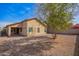 The backyard features a low maintenance yard, covered patio, and exterior of the house at 1541 W Lynne Ln, Phoenix, AZ 85041