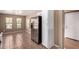 Open kitchen with stainless refrigerator and white pantry at 1541 W Lynne Ln, Phoenix, AZ 85041
