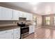 Kitchen features white cabinets and stainless steel oven and range at 1541 W Lynne Ln, Phoenix, AZ 85041