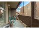 Cozy balcony featuring blue bistro set and striped rug, perfect for relaxing outdoors at 1645 W Baseline Rd # 2176, Mesa, AZ 85202
