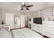 Bedroom featuring hardwood floors, a ceiling fan, and golf club decor along the wall at 1645 W Baseline Rd # 2176, Mesa, AZ 85202