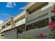 Apartment building featuring multiple balconies and a view of the blue sky at 1645 W Baseline Rd # 2176, Mesa, AZ 85202