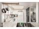 Kitchen with granite countertops, stainless steel sink, white cabinetry, and modern appliances at 1645 W Baseline Rd # 2176, Mesa, AZ 85202