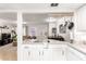 Bright, open-concept view of the kitchen into the living room/dining room area at 1645 W Baseline Rd # 2176, Mesa, AZ 85202