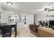 Spacious living area showcasing an open layout with kitchen, staircase and comfortable seating at 1645 W Baseline Rd # 2176, Mesa, AZ 85202