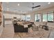 Bright and open living room connects seamlessly to the outdoor space and gourmet kitchen at 16911 W Palm Ln, Goodyear, AZ 85395