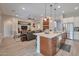 Spacious open concept with kitchen, dining, and living areas for modern living and entertaining at 16911 W Palm Ln, Goodyear, AZ 85395