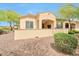 Charming backyard patio area offering a beautiful outdoor space with lush greenery and stone landscaping at 16955 W Cypress St, Goodyear, AZ 85395