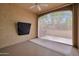 Covered patio with ceiling fan and sunshades for comfortable outdoor living and relaxing at 16955 W Cypress St, Goodyear, AZ 85395