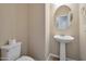Powder room with a pedestal sink and a toilet at 16955 W Cypress St, Goodyear, AZ 85395