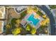 Aerial view of community pool, playground, and clubhouse surrounded by green landscaping and residential buildings at 17160 N 9Th Pl, Phoenix, AZ 85022