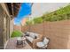 Inviting backyard seating area on a paved patio with an artificial turf lawn at 17160 N 9Th Pl, Phoenix, AZ 85022