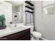 Modern bathroom featuring stylish fixtures, a sleek vanity, and an elegant shelf decor at 17160 N 9Th Pl, Phoenix, AZ 85022