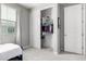 Neutral bedroom with open closet and white sliding doors at 17160 N 9Th Pl, Phoenix, AZ 85022