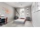 Unique bedroom featuring airplane decor, two side tables and a grey comforter at 17160 N 9Th Pl, Phoenix, AZ 85022