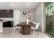 Cozy dining area with a modern table, seating for four, and natural light at 17160 N 9Th Pl, Phoenix, AZ 85022