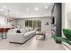 Open-concept living room featuring a sleek fireplace and access to the outdoor patio at 17160 N 9Th Pl, Phoenix, AZ 85022