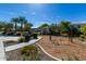 Community playground featuring a swingset, bench, and green space with palm trees under a clear blue sky at 17160 N 9Th Pl, Phoenix, AZ 85022