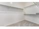 Spacious walk-in closet equipped with multiple levels of shelving, providing ample storage space at 17160 N 9Th Pl, Phoenix, AZ 85022