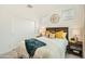 Comfortable bedroom featuring neutral decor, an inviting bed, and ample natural light from the windows at 17341 W Fallen Leaf Ln, Surprise, AZ 85387