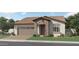 Charming single-story home with stone accents, landscaped yard, and attached two-car garage at 17341 W Fallen Leaf Ln, Surprise, AZ 85387