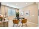 Inviting home office space with a large window for natural light and modern furnishings at 17341 W Fallen Leaf Ln, Surprise, AZ 85387