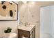 Stylish powder room featuring quartz counters, modern fixtures, and contemporary decor at 17341 W Fallen Leaf Ln, Surprise, AZ 85387