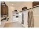 Spacious walk-in closet featuring ample shelving and rods for optimal storage and organization at 17341 W Fallen Leaf Ln, Surprise, AZ 85387