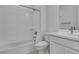 A bright bathroom features a shower-tub combo with sleek fixtures and vanity at 17827 W Medlock Dr, Litchfield Park, AZ 85340