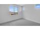 Carpeted bedroom offers lots of natural light with bright paint and multiple windows at 17827 W Medlock Dr, Litchfield Park, AZ 85340