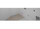 Dedicated laundry area with tile floor and hookups provides space for appliances at 17827 W Medlock Dr, Litchfield Park, AZ 85340