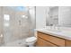 Bathroom featuring a vanity with quartz countertop, glass enclosed shower with modern tile, and fixtures at 17841 W Windsor Blvd, Litchfield Park, AZ 85340