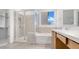 Bright bathroom featuring a shower, a bathtub, and modern vanity at 17841 W Windsor Blvd, Litchfield Park, AZ 85340